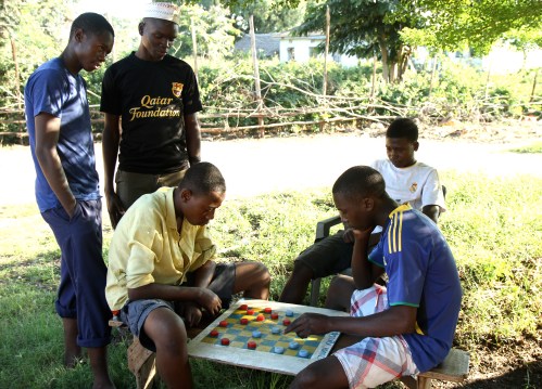 Playing checkers with bottle caps