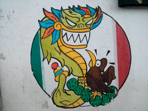 The Mexican flag features an eagle devouring a serpent (on top of a Nopal). This is a slightly different take. 
