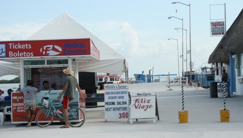 Enrique checking out the prices to get the ferry back to the mainland.